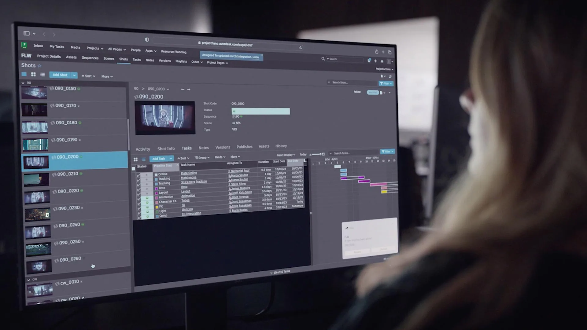 User reviewing project timeline on a monitor