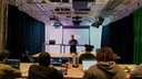 Instructor presenting to students in tech studio