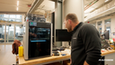 Autodesk Fusion Machine Connect — printer in modern workspace